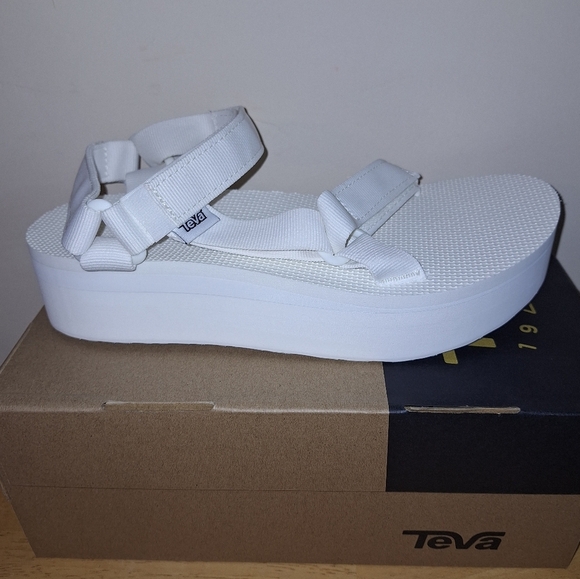 A pair of Teva W. Flatform Universal sandals in solid white in a ladies Size 9. - Picture 9 of 10